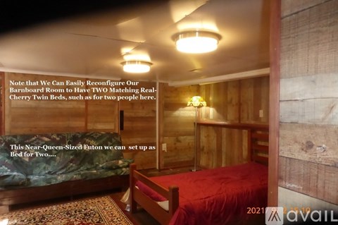 A bedroom with a red bed and a note about reconfiguring the room for two beds.