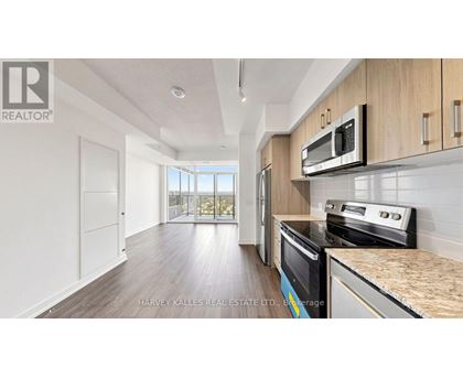 A kitchen with a microwave above the stove.