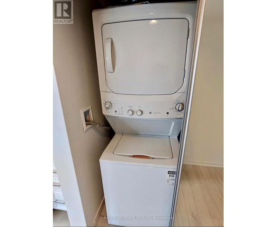 A white dishwasher is in a kitchen.