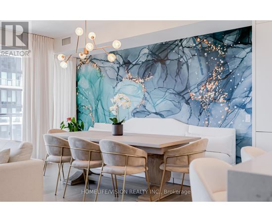 A dining room with a table set for four.