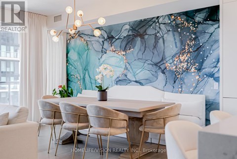 A dining room with a table set for four.