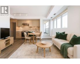 A modern living room with a dining table and chairs.