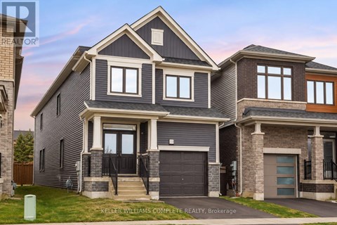 A modern house with a grey and brown exterior is for sale.