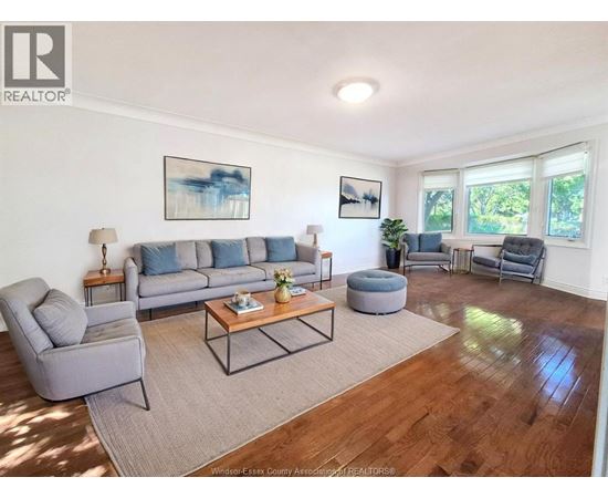 A room with wooden floors and white walls.