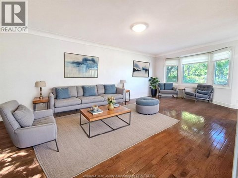 A room with wooden floors and white walls.