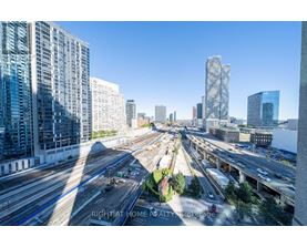 A cityscape with a highway and buildings.