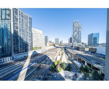 A cityscape with a highway and buildings.