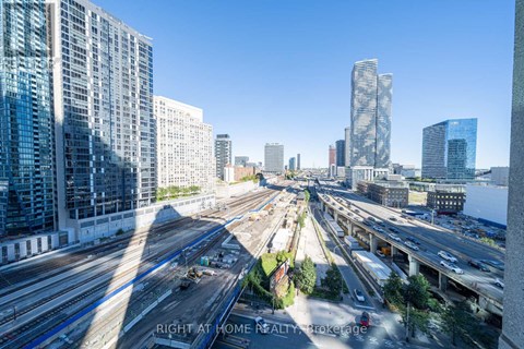 A cityscape with a highway and buildings.