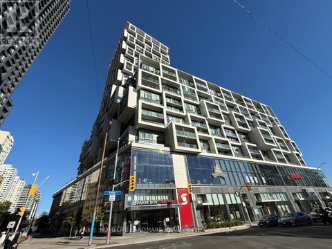 A tall building with a red sign that says "S" on it.