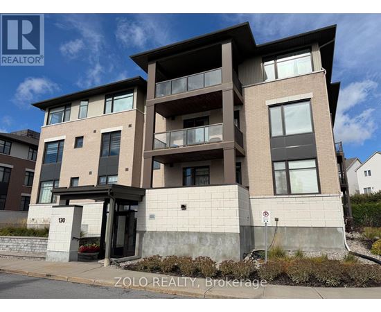 A modern two-story residential building with a balcony on the second floor.