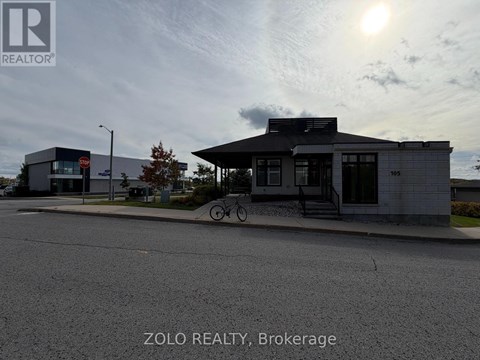 A street view of a building with the text "ZOLO REALTY, Brokerage" on the bottom.