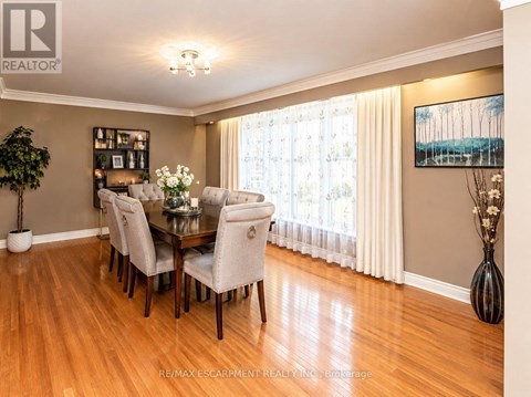 A dining room with a table set for six.