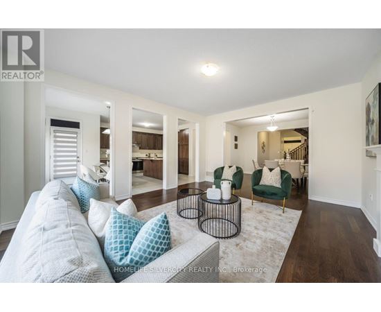 A living room with a grey couch and a coffee table.
