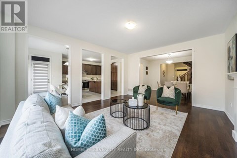A living room with a grey couch and a coffee table.