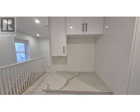 A white room with a marble floor and a window.