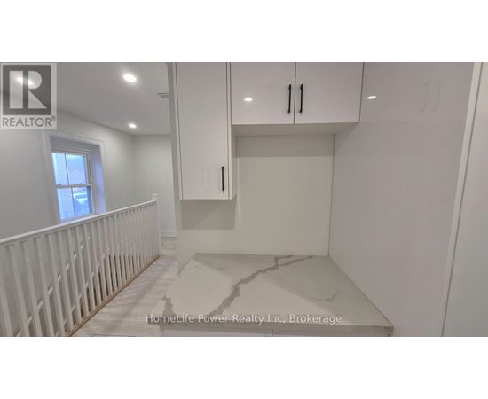 A white room with a marble floor and a window.