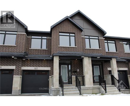 A two-story brick house with a black front door and windows.