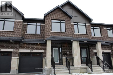 A two-story brick house with a black front door and windows.