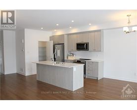 A modern kitchen with a large island in the middle.