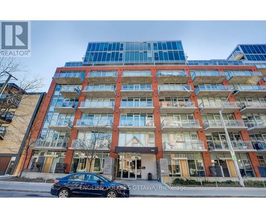 A car is parked in front of a building with the sign "Engels & Volkers OTTAWA Brokerage".