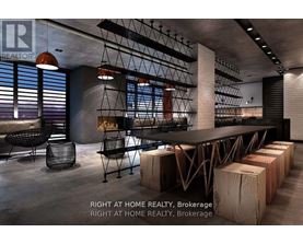 A modern dining room with a long table and chairs.