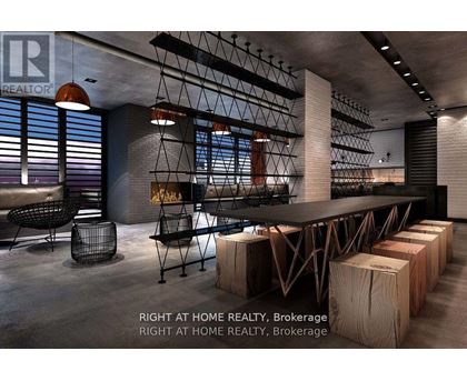 A modern dining room with a long table and chairs.