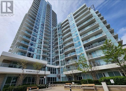 A modern apartment complex with a glass facade and a sign that reads "10 Deerlick Courts".