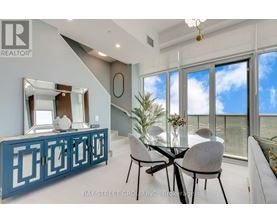 A dining room with a glass table and chairs.