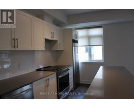 A kitchen with a stove top oven and a dishwasher.
