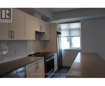 A kitchen with a stove top oven and a dishwasher.