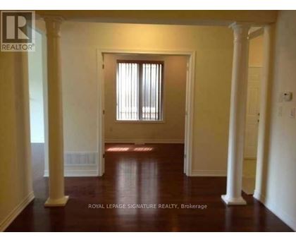 A room with a doorway and pillars.