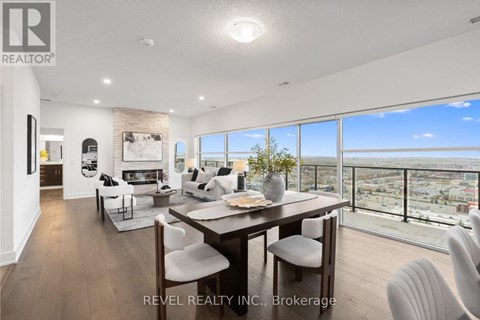 A modern dining room with a view of the city.