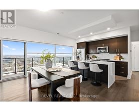 A modern kitchen with a dining table and chairs.