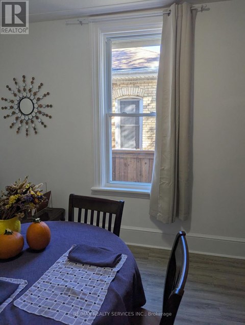 A dining room with a table set for two.