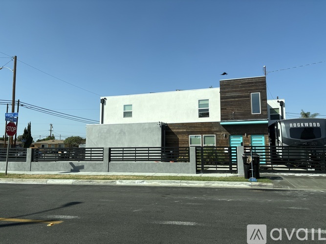 A building with a blue awning and a sign that says "Rockwood" on it.