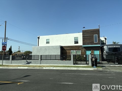 A building with a blue awning and a sign that says "Rockwood" on it.
