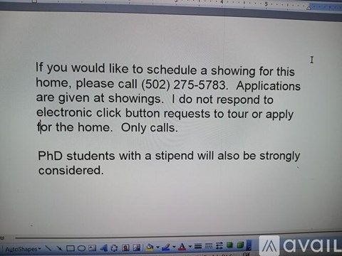 A computer screen displays a message about scheduling a showing for a home and provides a phone number to call.
