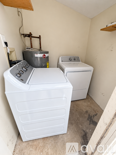 A washer and dryer in a small room.