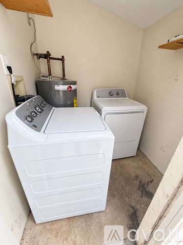 A washer and dryer in a small room.