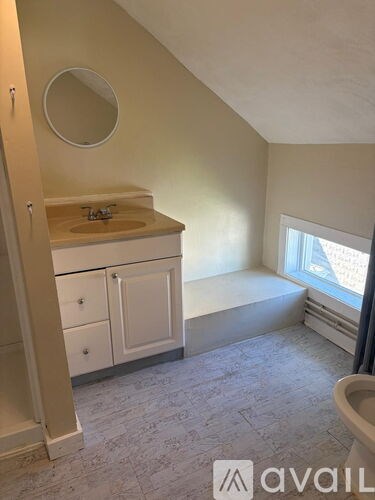 A kitchen with a sink and a window.