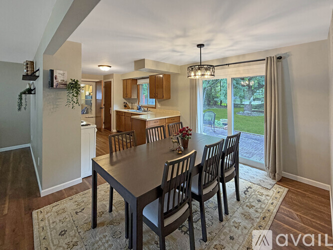A dining room with a table and chairs is shown.
