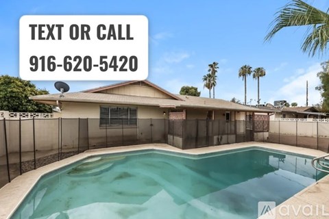 A pool in a backyard with a sign that says "Text or Call 916-620-5420".