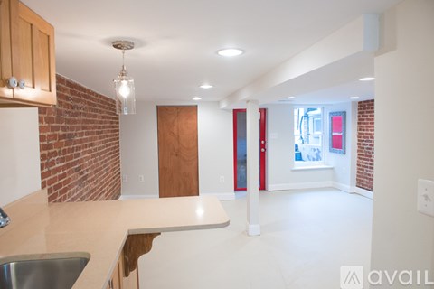 A kitchen with a sink and a window.