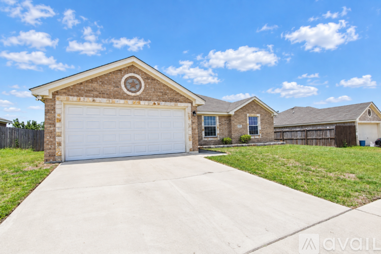 A house with a garage is available for sale.