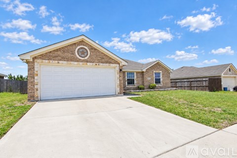 A house with a garage is available for sale.