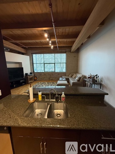 A kitchen with granite countertops and a sink.
