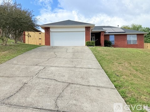 A house with a driveway in front of it.