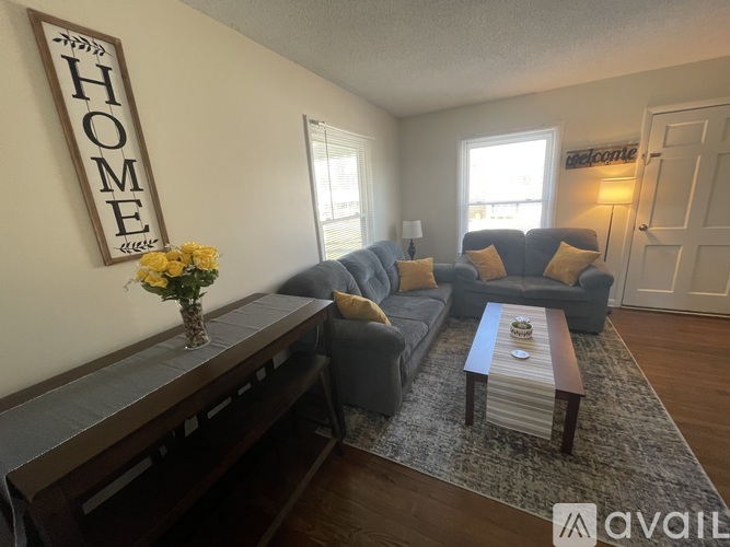A living room with a sofa set and a coffee table.