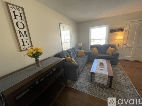 A living room with a sofa set and a coffee table.