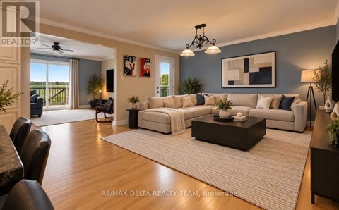 A spacious living room with a large couch and a coffee table.